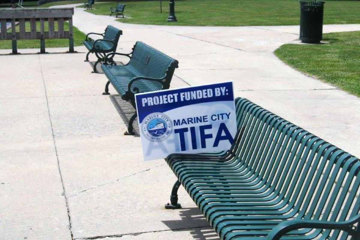 Park Benches with TIFA Sign